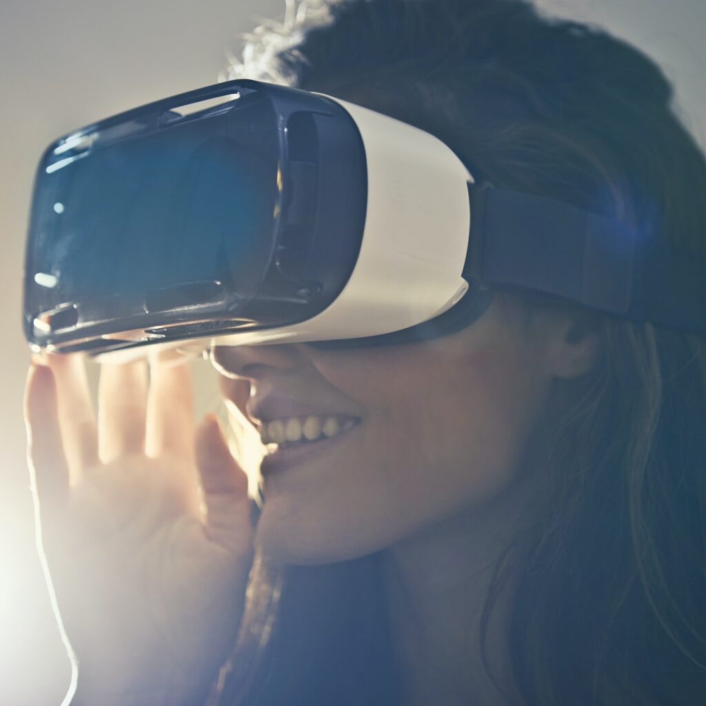 Women smiling while wearing a virtual reality headset