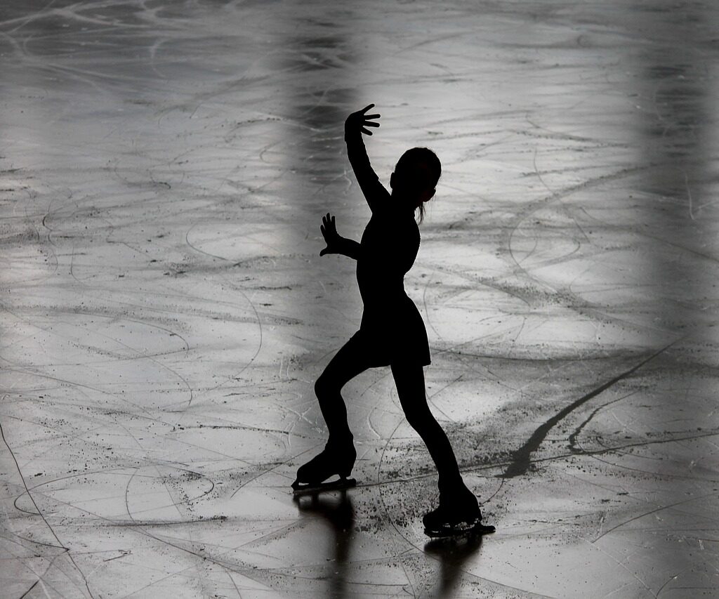 A picture of a figure skater on ice.
