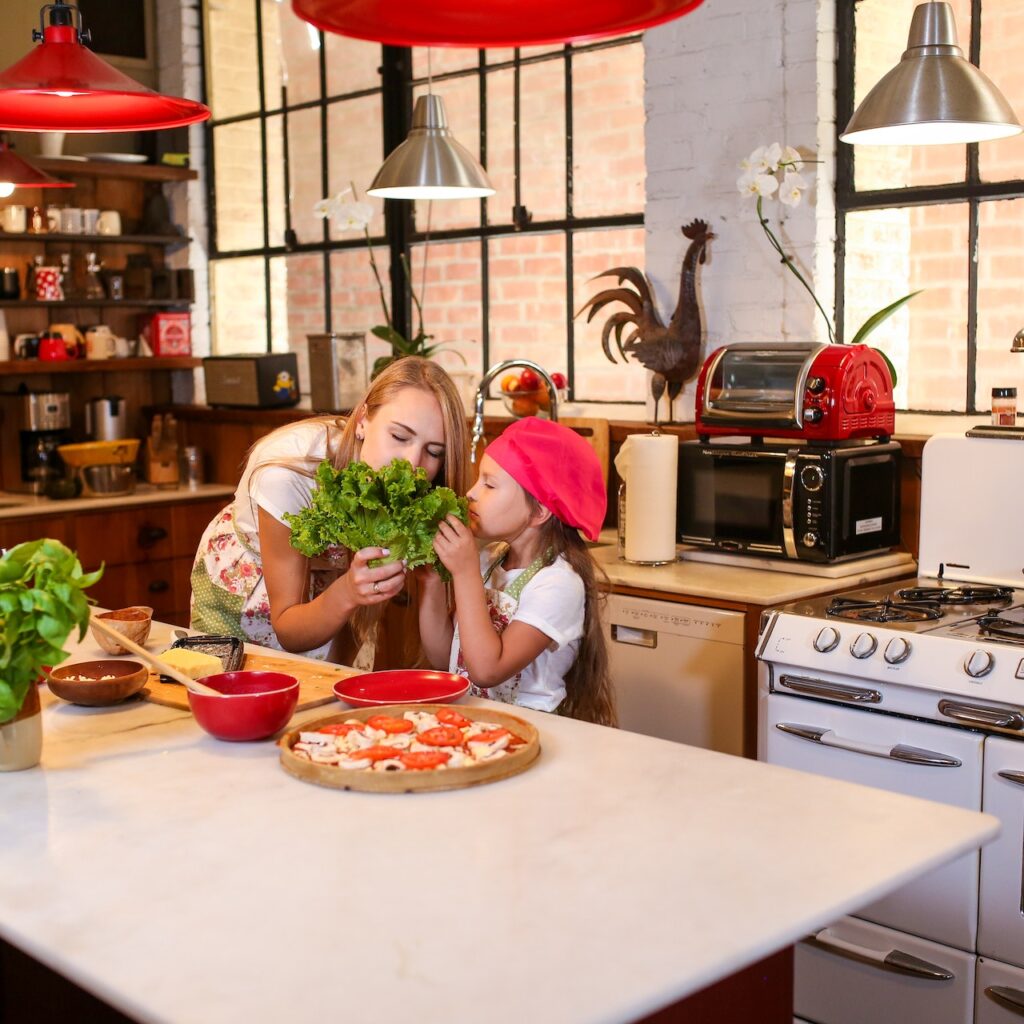 woman and child smelling lettuce