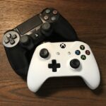 Black and white video game controllers for a console.