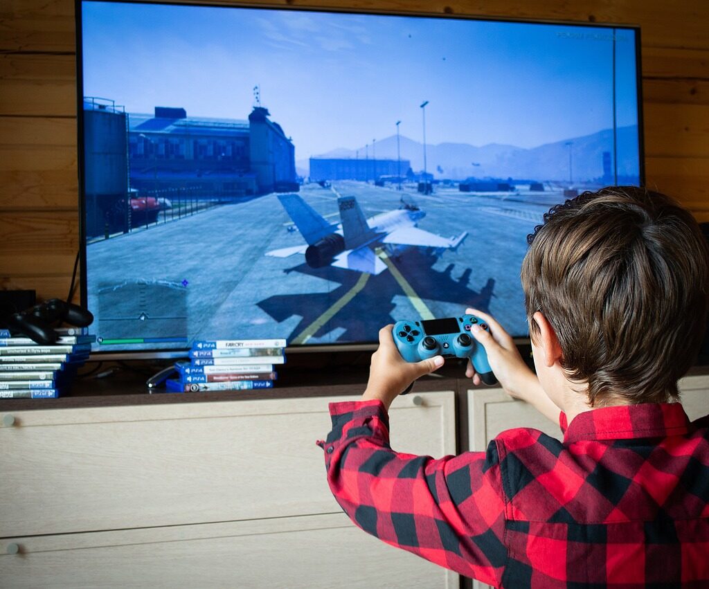 A kid playing a video game.