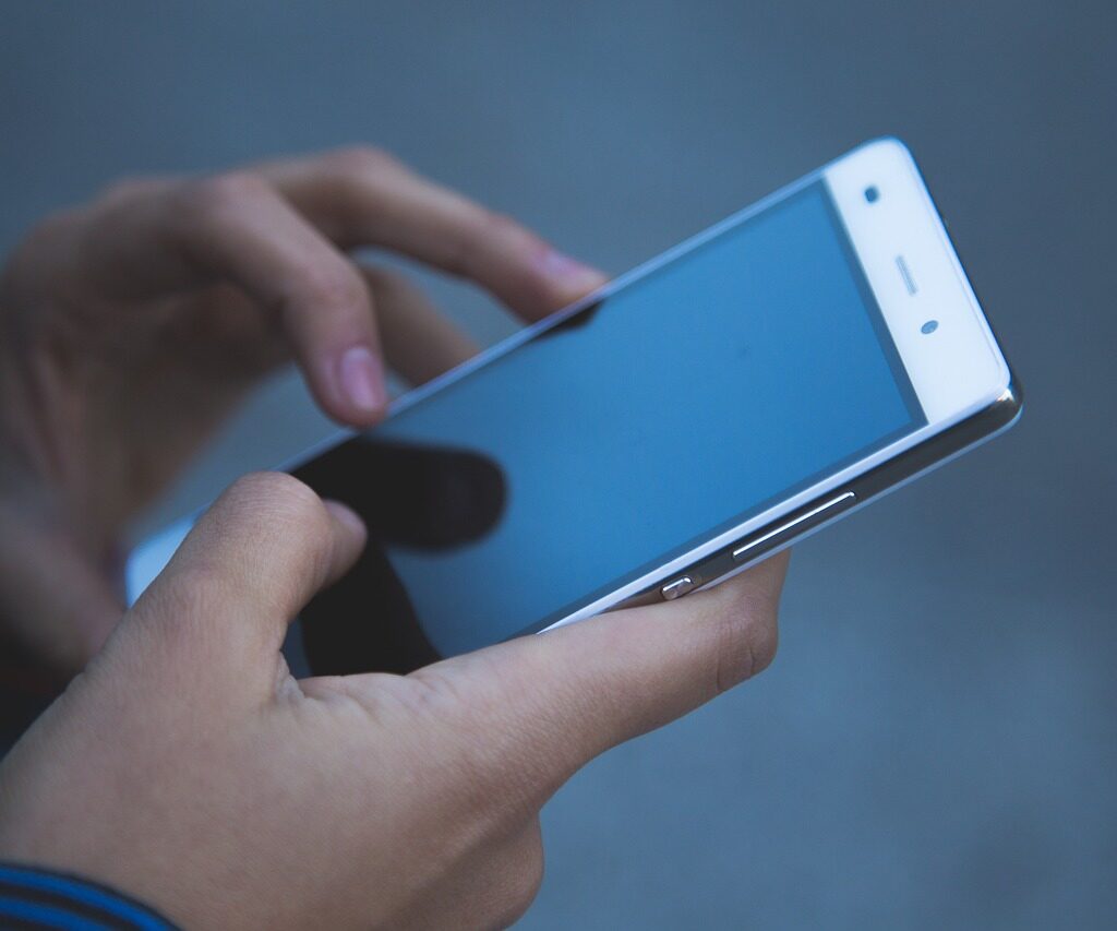 A person holding their phone. 