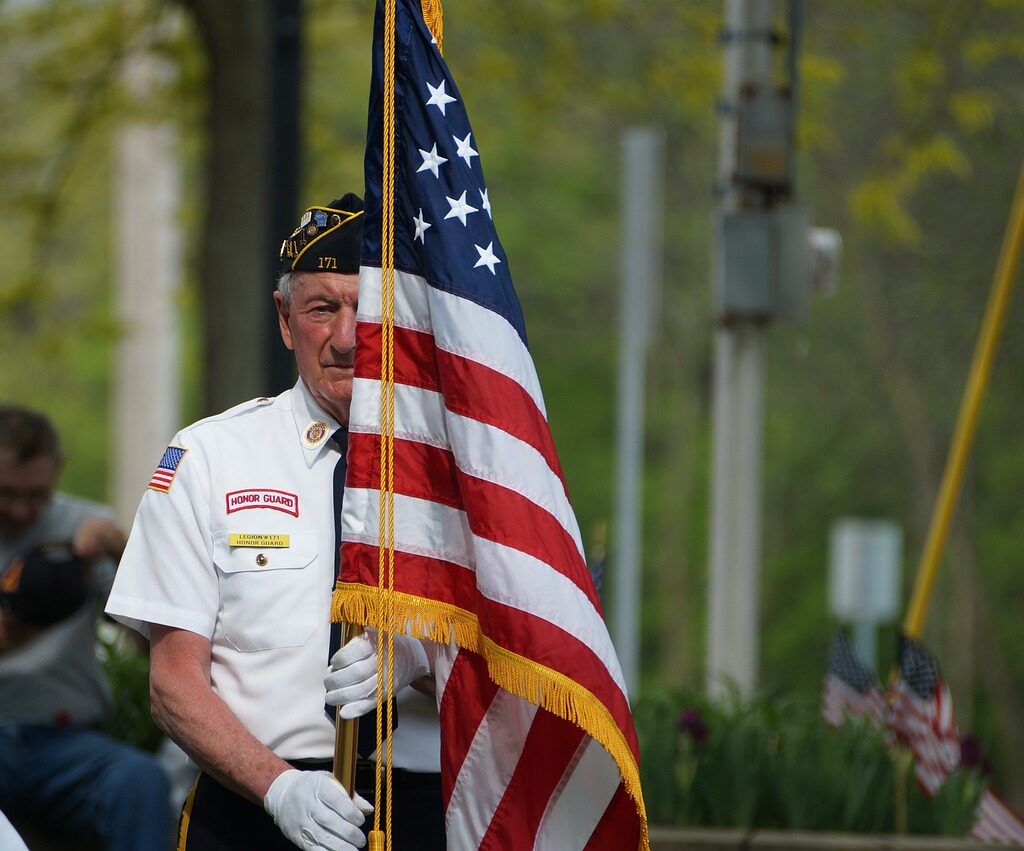 A man holding the American flag.