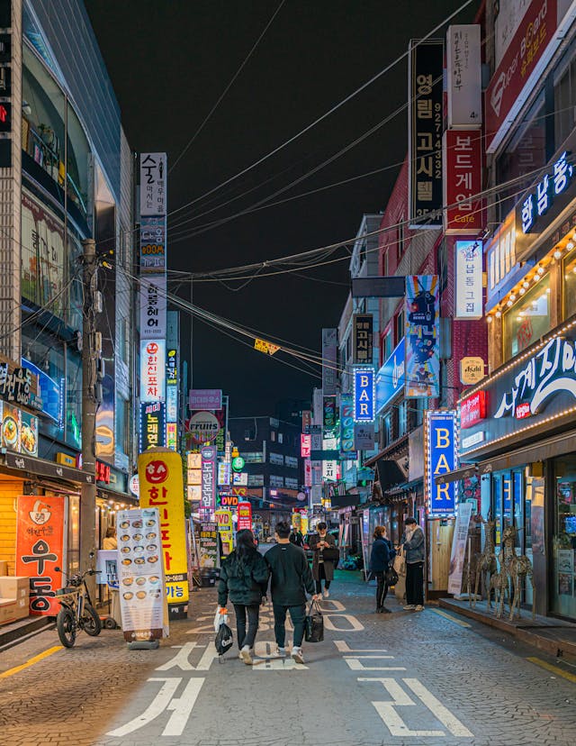 South Korea street with hangul signs and American English word "BAR".