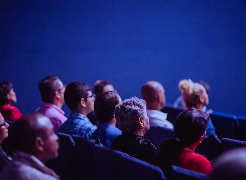 People sitting at a convention.