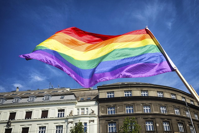 Rainbow flag flying in front of building