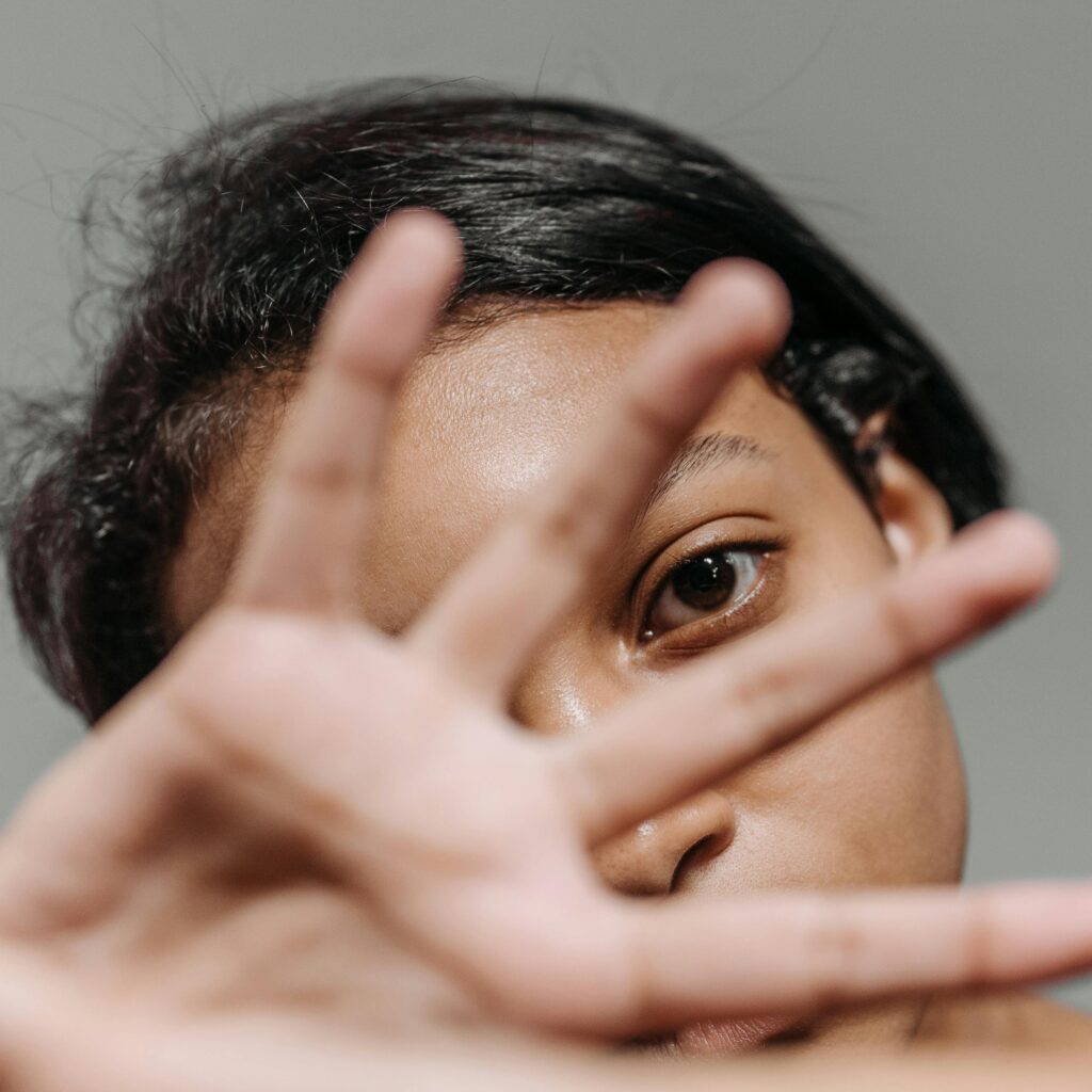 Woman with hand over her face