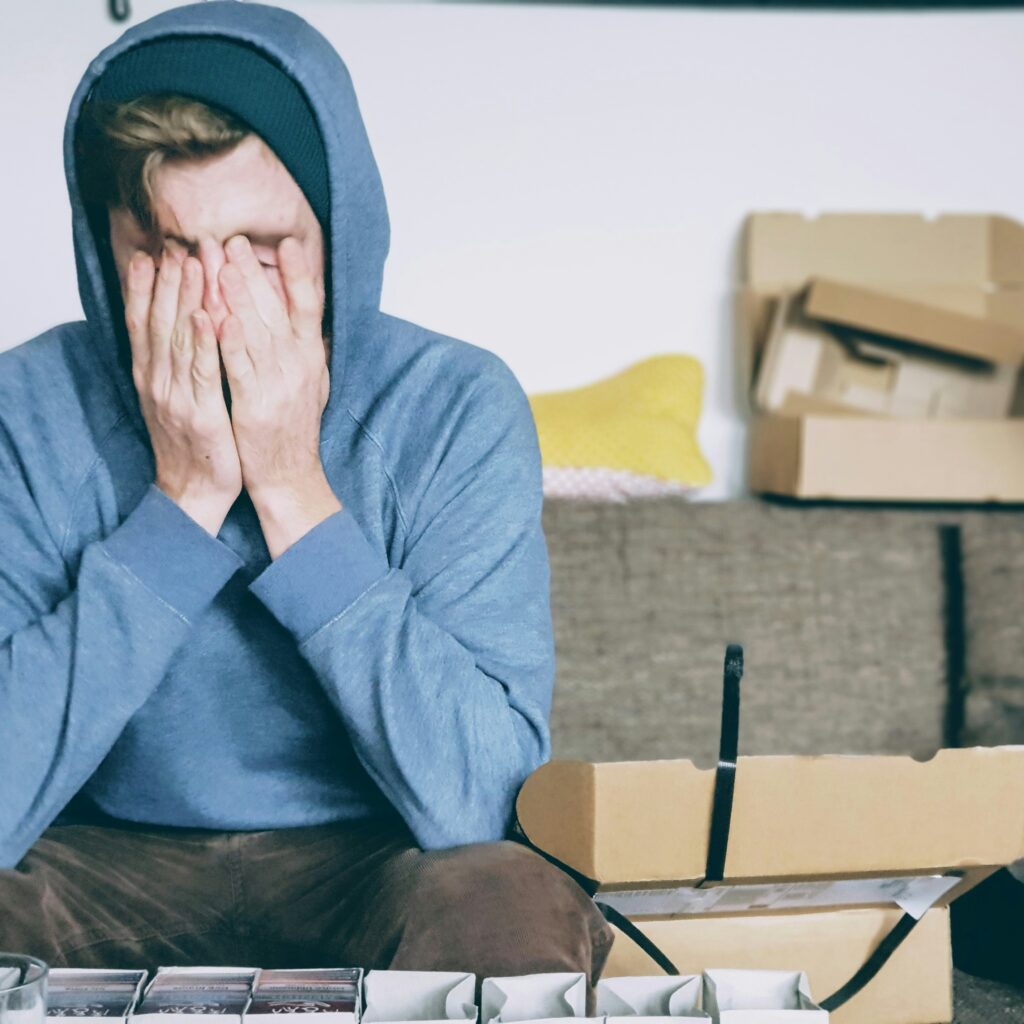 Man overwhelmed sorting things